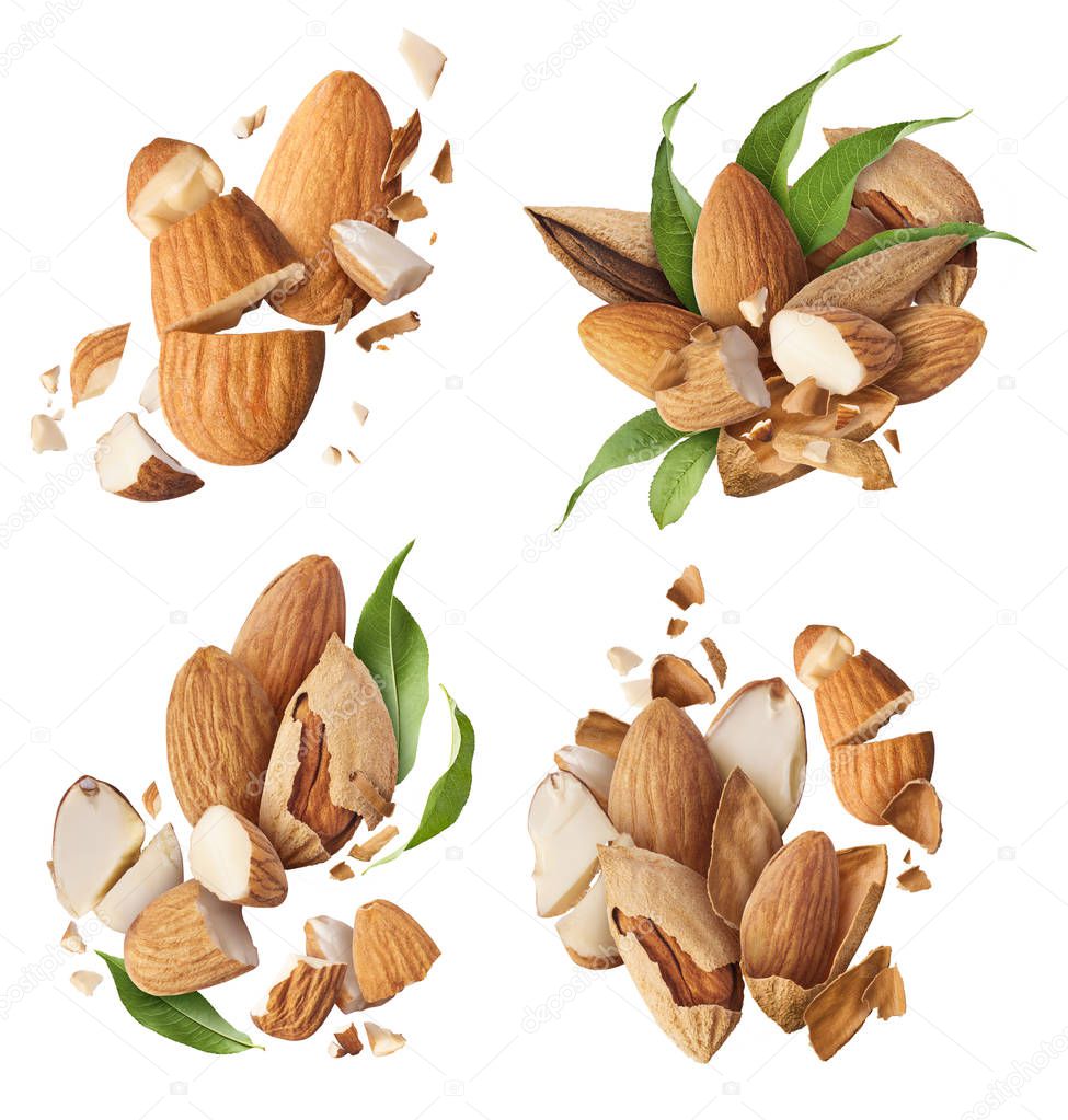 Set with fresh raw almonds. Flying in air fresh raw whole and cut almonds  isolated on white background. Concept of Almonds is torn to pieces close-up. High resolution image