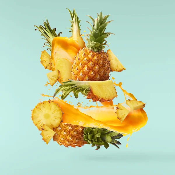 Flying in air fresh ripe whole and cut baby Pineapple with slice — Stock Photo, Image