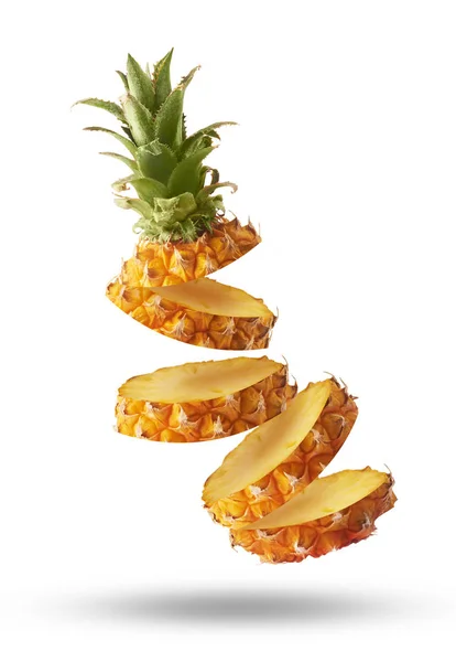 Flying in air fresh ripe whole and cut baby Pineapple with slice — Stock Photo, Image