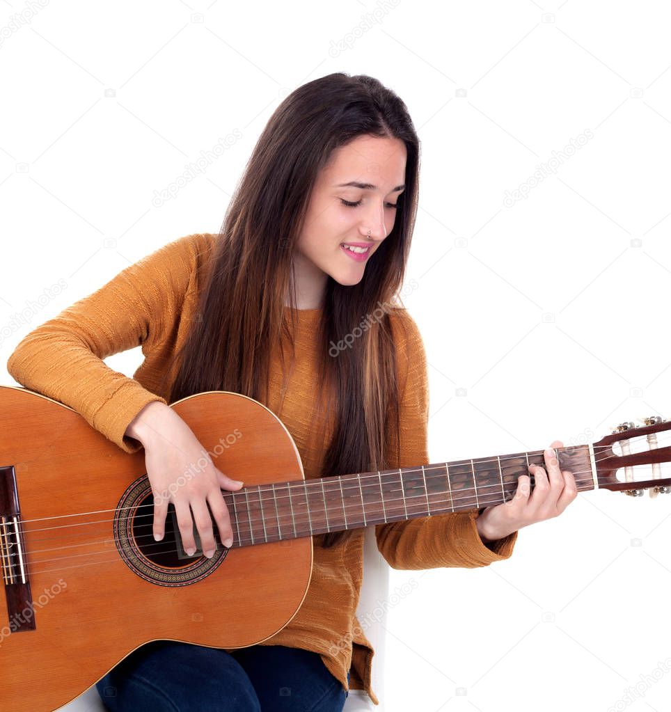 teenager girl playing guitar isolated on white background