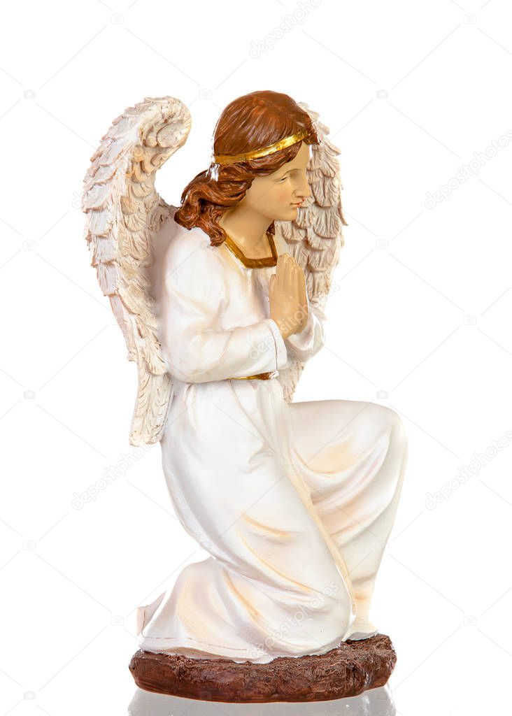 Ceramic figure of the angel of the nativity scene isolated on a white background