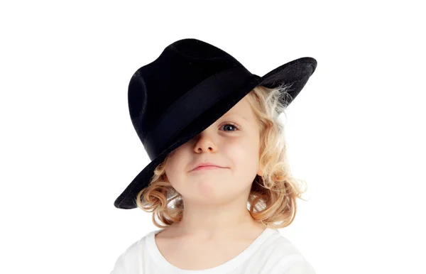 滑稽的小金发碧眼的孩子与黑帽子查出在白色背景 — 图库照片