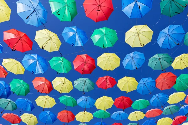 Colorful umbrellas on the sky to give shadow for the street