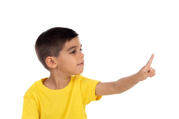 Gypsy child with yellow t-shirt pointing with the hand 