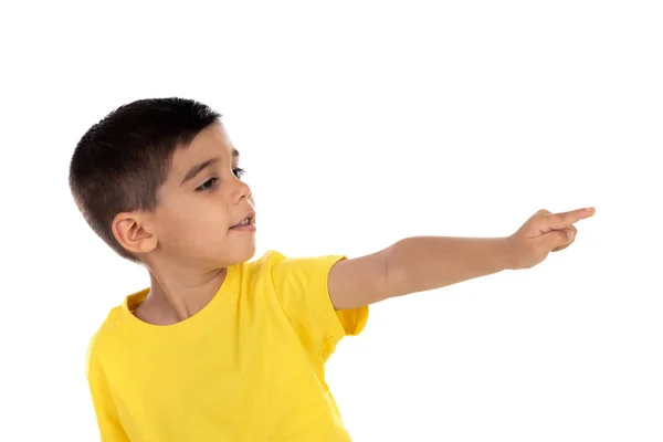 Gypsy child with yellow t-shirt pointing with the hand — Stock Photo, Image