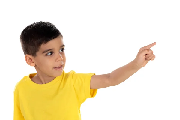 Gypsy child with yellow t-shirt pointing with the hand — Stock Photo, Image