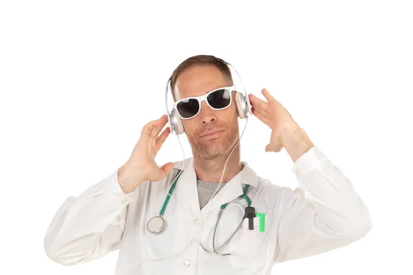 Handsome doctor with sunglasses listening music with headphones — Stock Photo, Image