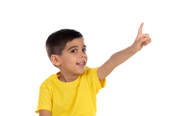 Gypsy child with yellow t-shirt pointing with the hand 