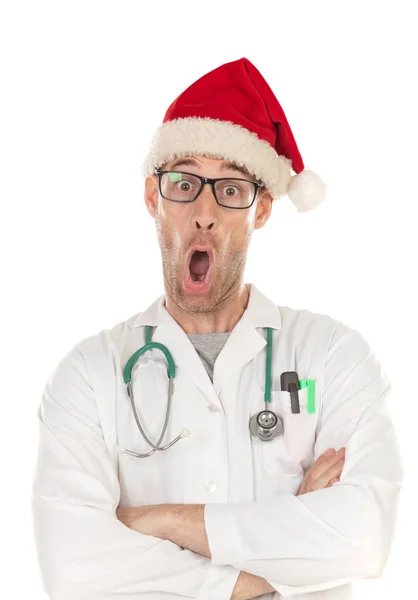 Handsome doctor with christmas hat wearing a Christmas hat — Stock Photo, Image
