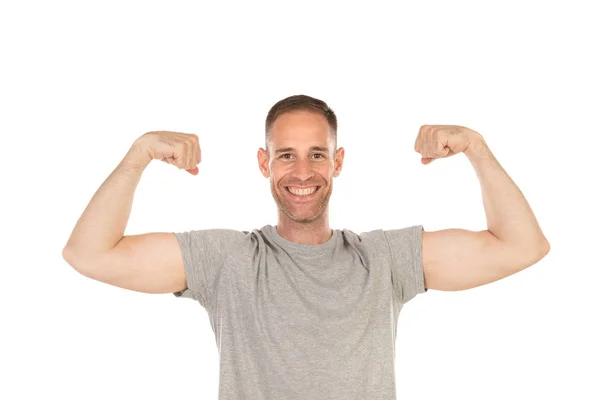 Przystojny Mężczyzna Pokazując Jego Biceps Izolowane Białym Tle — Zdjęcie stockowe