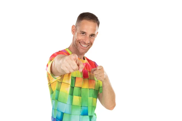 Handsome guy with colored tshirt pointing something with his han — Stock Photo, Image