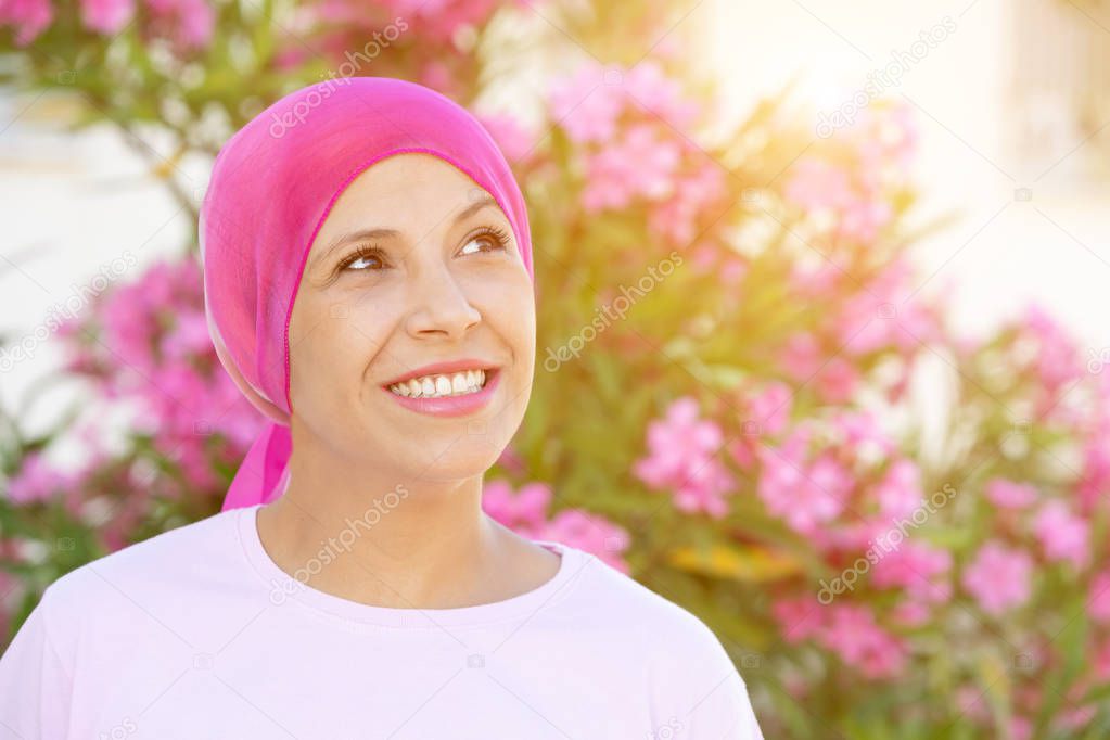 Woman with pink scarf on the head