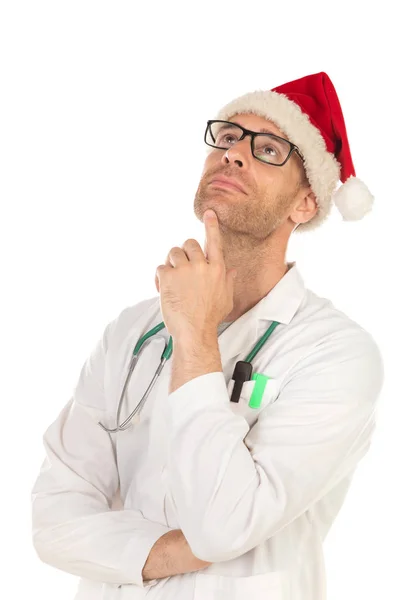 英俊的医生与圣诞帽戴着圣诞帽隔离在白色背景 — 图库照片
