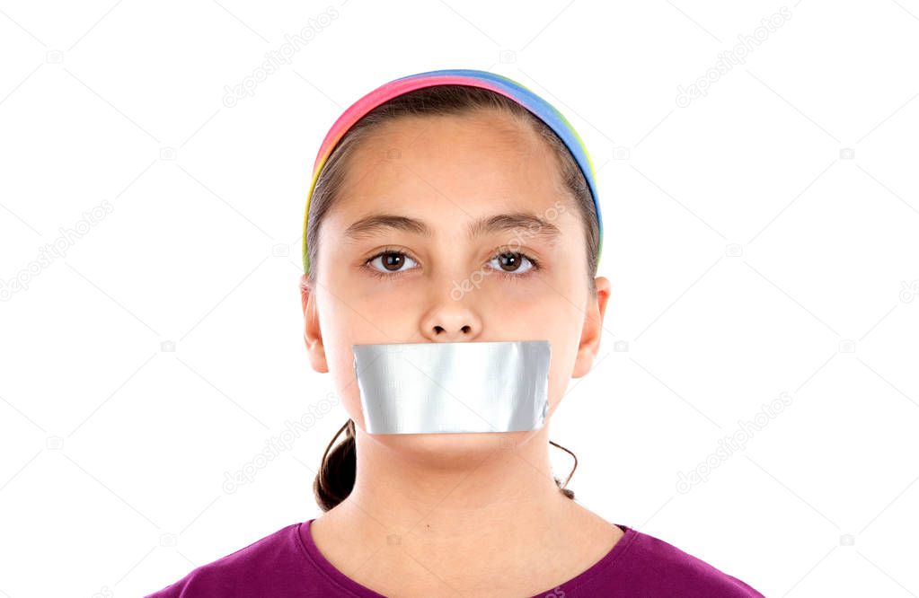 Serious girl with sticking plaster on her mouth looking at camera