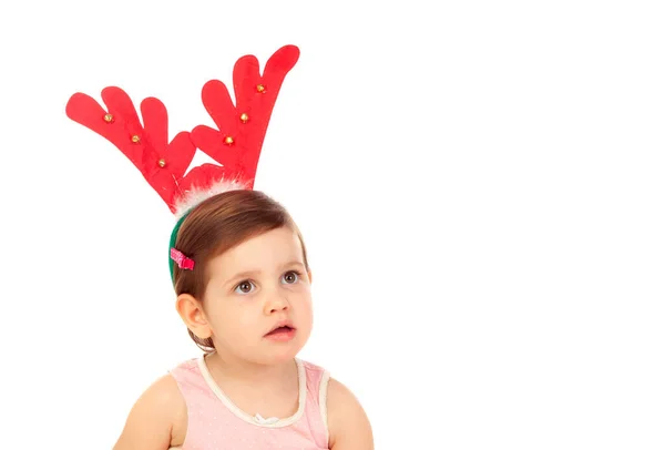 一个穿着白色背景的圣诞驯鹿角的有趣的孩子 — 图库照片