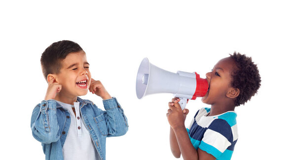 Funny children playing with a megaphone isolated on a white background