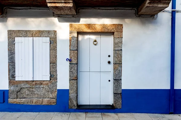 Beautiful vintage house with a door painted on white