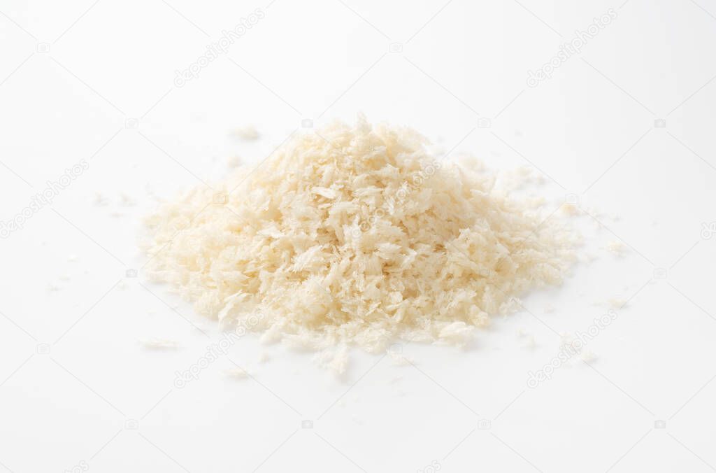 Crumbs placed on a white background were photographed from an angle.