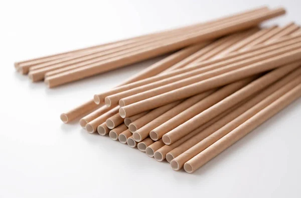 Paper straws on a white background