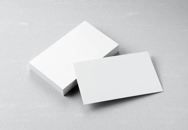 A plain business card on a gray background