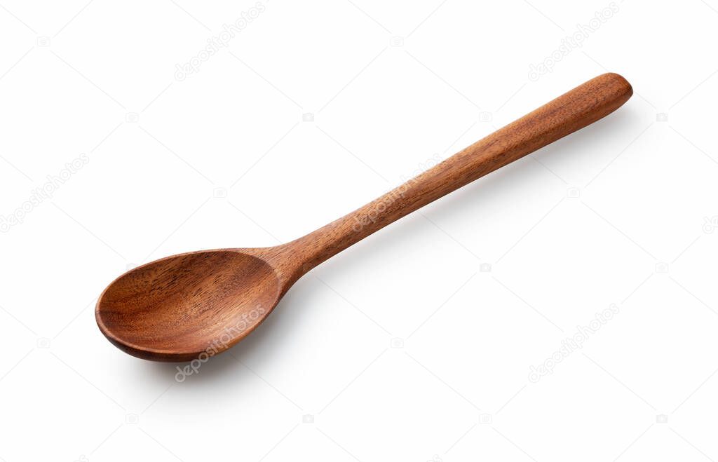 Angled shot of a wooden spoon placed on a white background