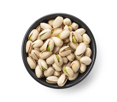 A bird's-eye view of the pistachios in a bowl set against a white background clipart