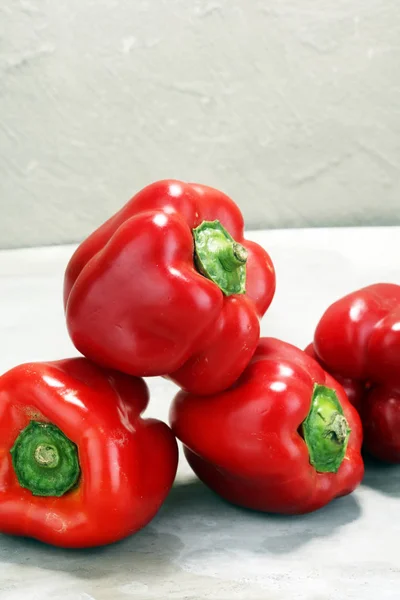 Fresh red bell pepper on grey background. raw vegetable.