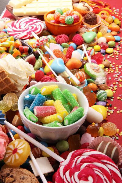 candies with jelly and sugar. colorful array of different childs sweets and treats