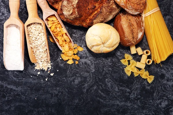 whole grain products with complex carbohydrates on rustic background