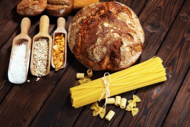 whole grain products with complex carbohydrates on rustic background clipart