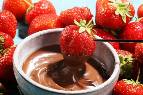 Fondue with Melting chocolate or melted chocolate and strawberry