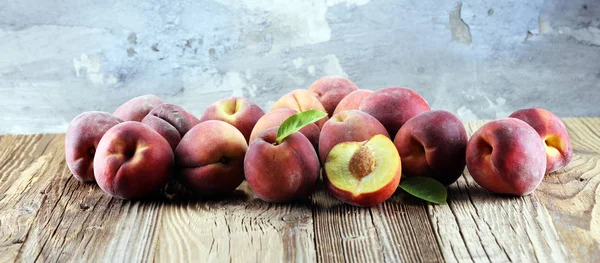 A group of ripe peaches on table. Fresh peach concept