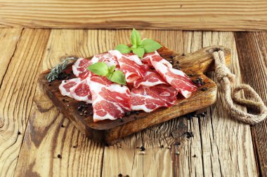 Italian sliced cured coppa with spices. Raw ham. Crudo or jamon. clipart