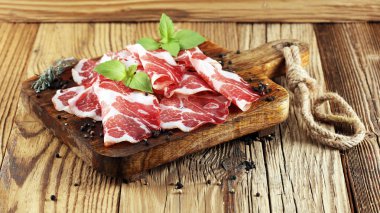 Italian sliced cured coppa with spices. Raw ham. Crudo or jamon. clipart