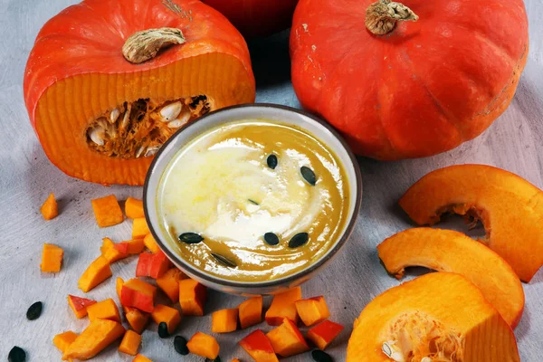 Roasted pumpkin and carrot soup with cream and pumpkin seeds on table — Stock Image Roasted Pumpkin Carrot Soup Cream Pumpkin Seeds Table Royalty Free Stock Photos