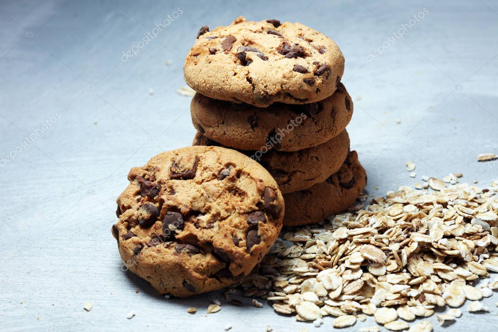 Chocolate cookies on rustic table. Chocolate chip cookies and cookies with oat flakes or oatmeal