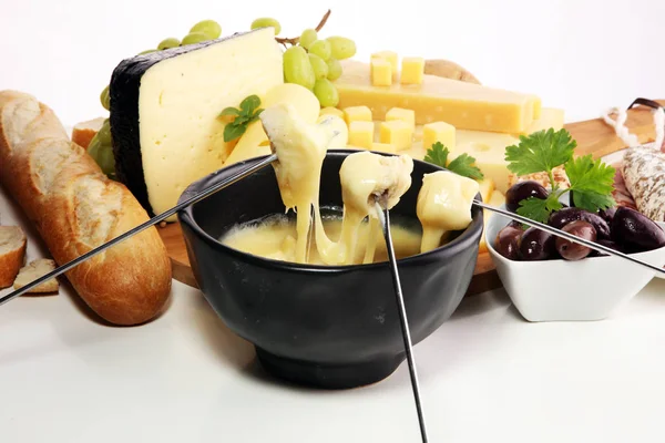 Gourmet Swiss Fondue Dinner Winter Evening Assorted Cheeses Board Alongside — Stock Photo, Image