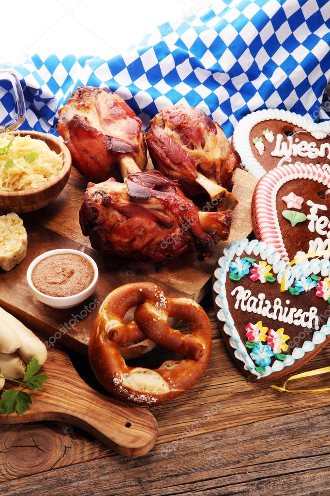 Traditional German cuisine, Schweinshaxe roasted ham hock. Beer, pretzels and various Bavarian specialties. Oktoberfest background