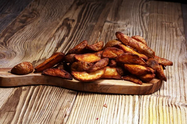 Baked potato wedges. homemade organic vegetable vegan vegetarian potato wedges snack food.