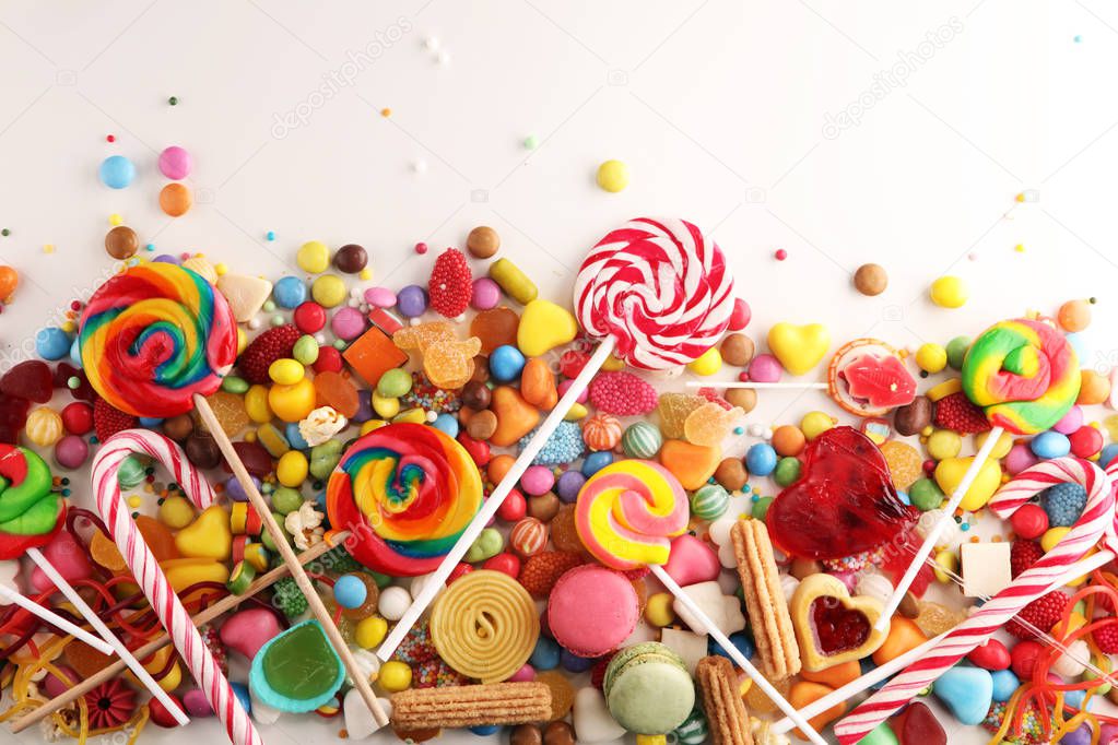 candies with jelly and sugar. colorful array of different childs sweets and treats