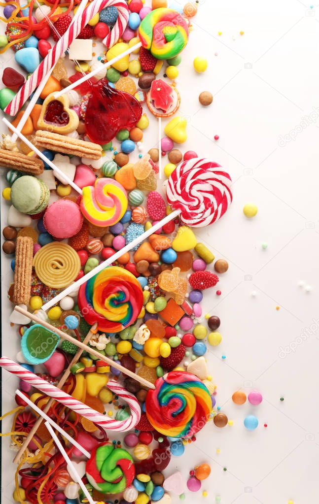 candies with jelly and sugar. colorful array of different childs sweets and treats