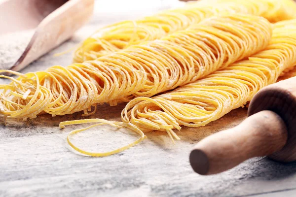 pasta. Fresh homemade pasta with pasta ingredients on the rustic table