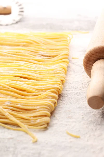 pasta. Fresh homemade pasta with pasta ingredients on the rustic table