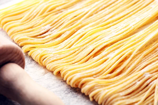 pasta. Fresh homemade pasta with pasta ingredients on the rustic table