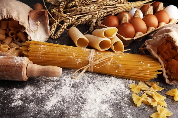 pasta. Fresh homemade pasta with pasta ingredients on the rustic table