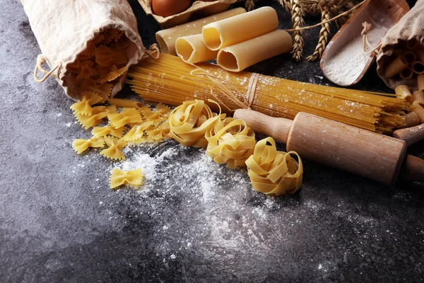 pasta. Fresh homemade pasta with pasta ingredients on the rustic table