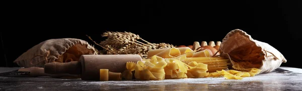 pasta. Fresh homemade pasta with pasta ingredients on the rustic table