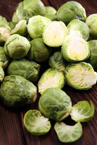 organic Brussels sprouts. Antioxidant balanced diet eating with Brussels sprouts on wooden table