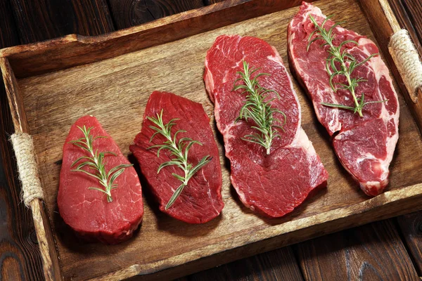 Steak raw. Barbecue Rib Eye Steak, dry Aged Wagyu Entrecote. Variety of Raw Black Angus Prime meat steaks Machete, Striploin, Rib eye, Tenderloin fillet mignon