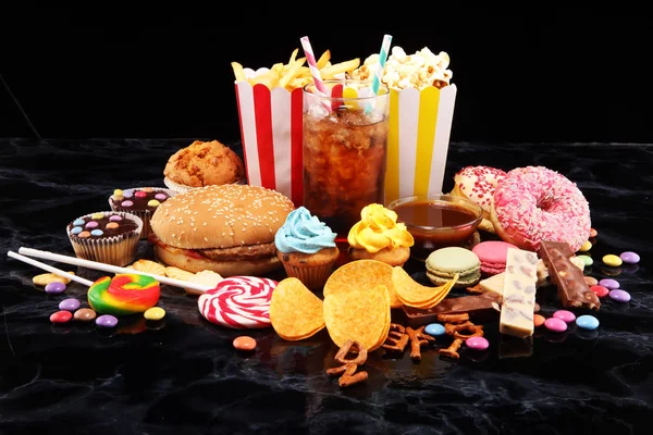 Unhealthy products. food bad for figure, skin, heart and teeth. Assortment of fast carbohydrates food.